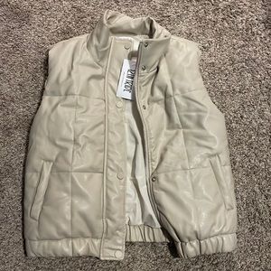 Size small somewhat oversized leather puffer vest